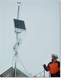 Todd Cations-Velvin, Safety Services Convenor and Level 2, for 2006-2007, inspects the weatherstation riming, July 2007